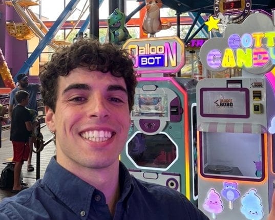 Sweet Robo cotton candy vending machine spinning a fresh cloud in front of customers